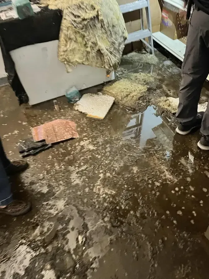 Black water backup cleanup underway in a home