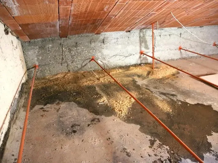 Water damage in the crawl space under a raised floor